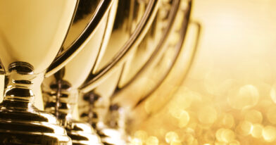 Row Of Trophies With Glitter And Confetti