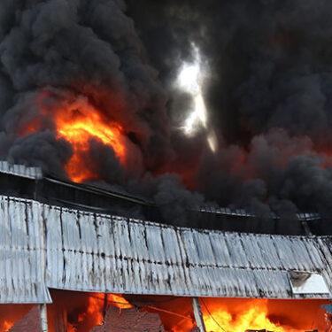 Massive Warehouse Fire Sends Debris Flying Leaving Clean-up Catastrophe