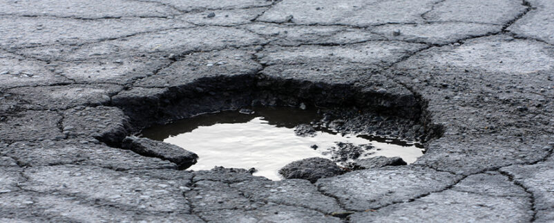 Gas Station Sued After Customer Trips in 1-Inch Pothole