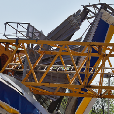Crane Collapses at YMCA Construction Site, Narrowly Missing Driver